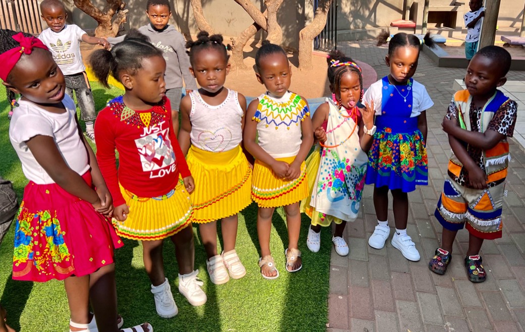 Zonke Izizwe children dressed in traditional clothing for a school celebration